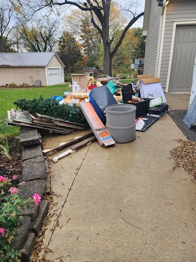 Dumpster being loaded with debris for 3 Yard Dumpster Rental in Presque Isle